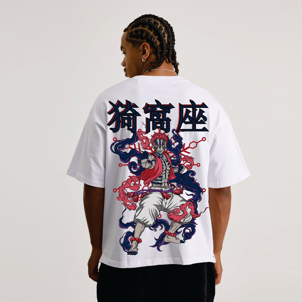 Person wearing a white t-shirt with a colorful graphic design on the back against a plain background