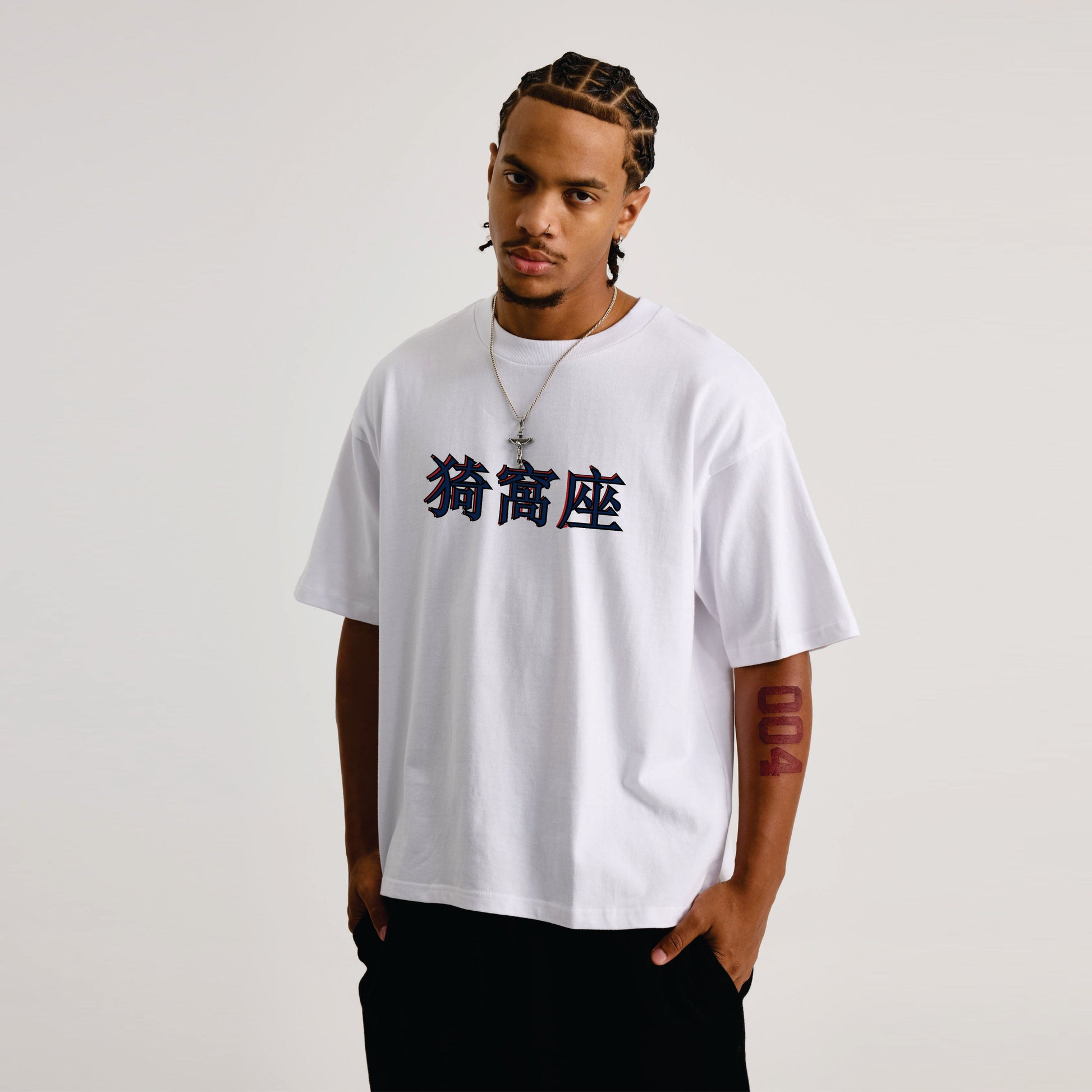 Person wearing a white t-shirt with black text on a plain background