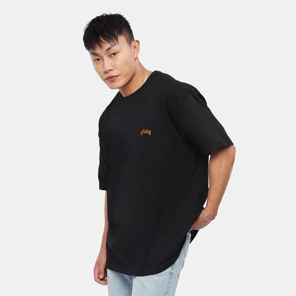 Person wearing a black t-shirt with a logo on a white background