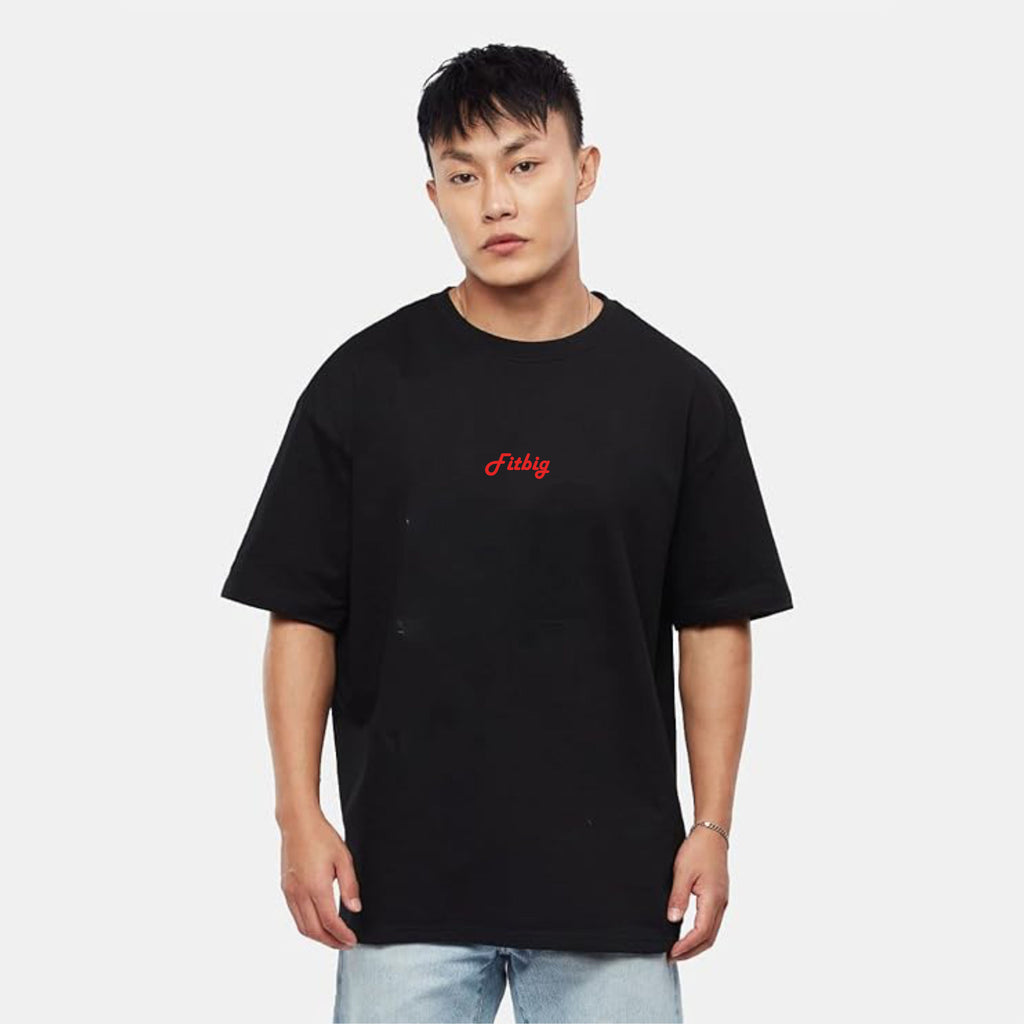 Person wearing a black t-shirt with red text on a white background