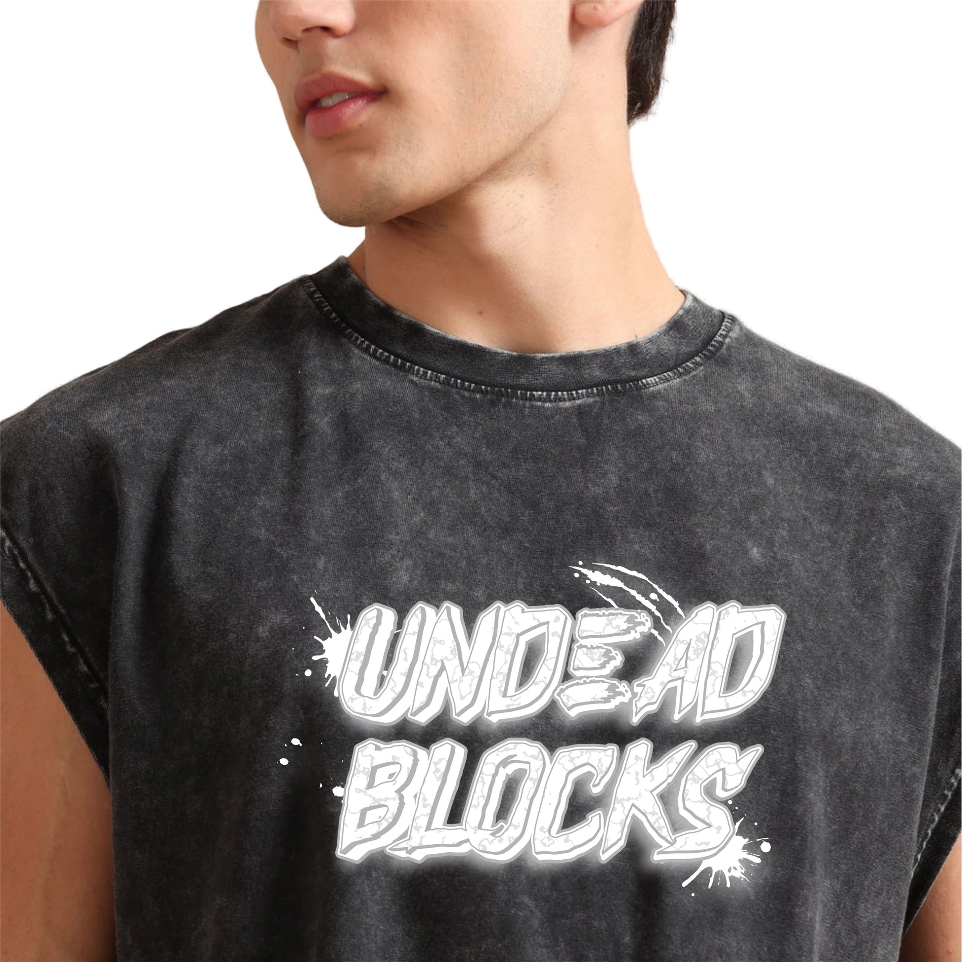 Person wearing a black sleeveless t shirt with 'UNDEAD BLOCKS' text design.