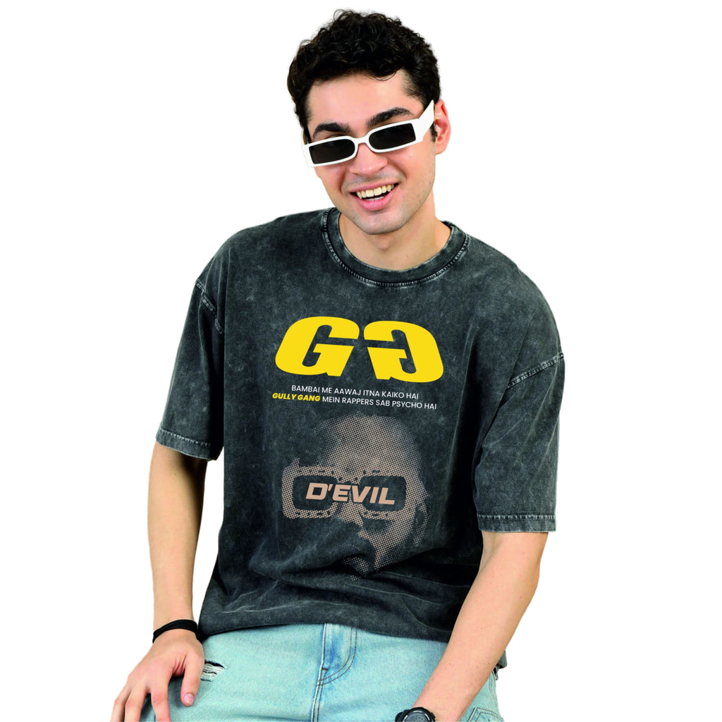 Person wearing a black t-shirt with yellow and white text on a white background
