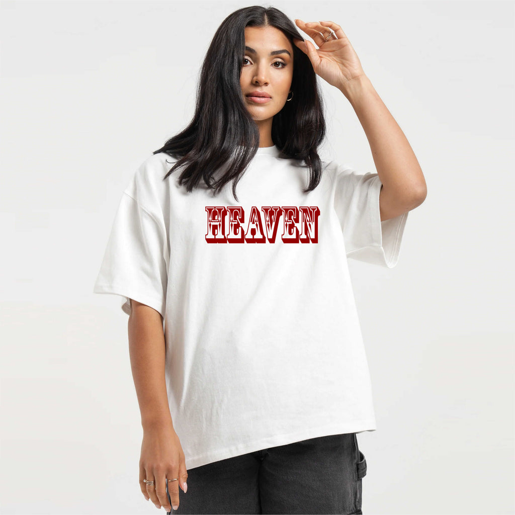 Person wearing a white t-shirt with 'HEAVEN' printed in red on a plain background