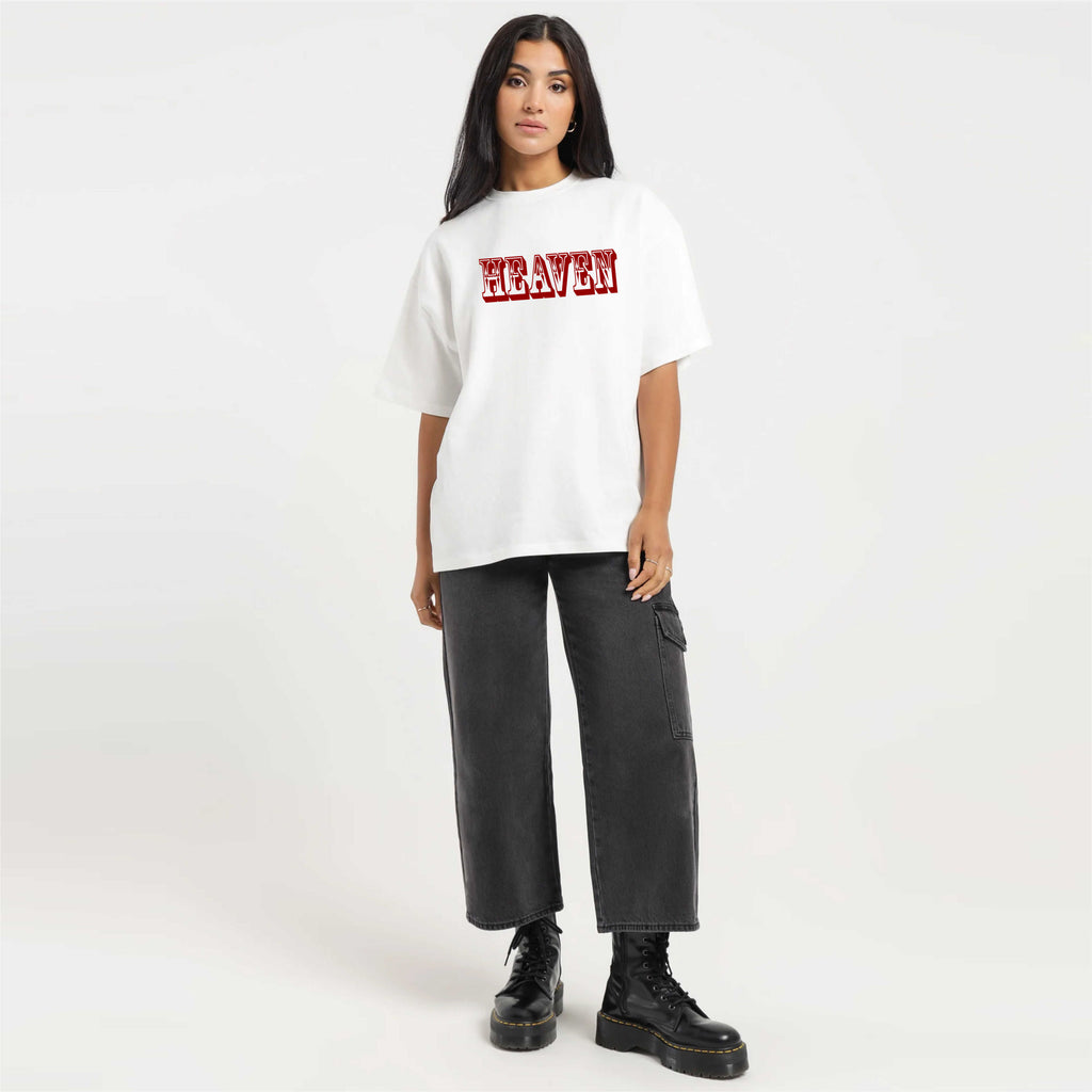 Person wearing a white t-shirt with 'HEAVEN' text, black pants, and black shoes on a white background