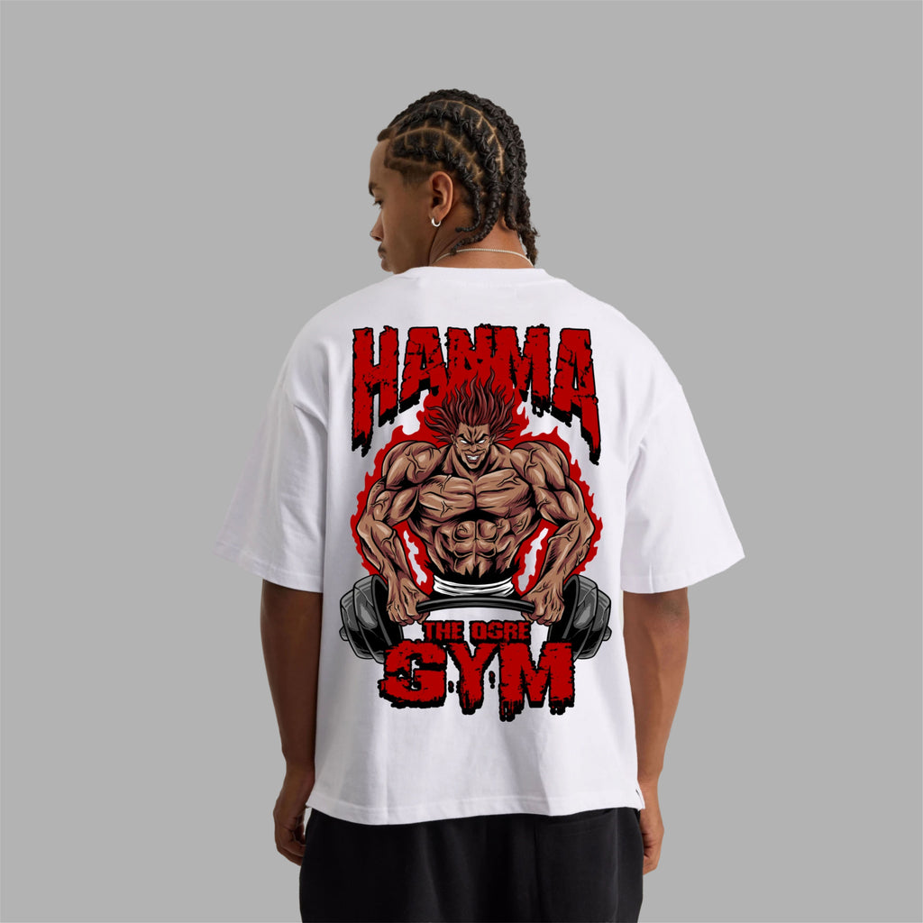 Person wearing a white t-shirt with a graphic design on the back, featuring text and a muscular figure, against a gray background.