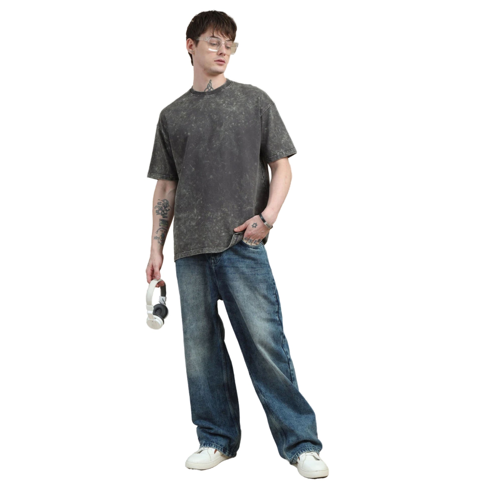 Person wearing a gray t-shirt and blue jeans on a white background