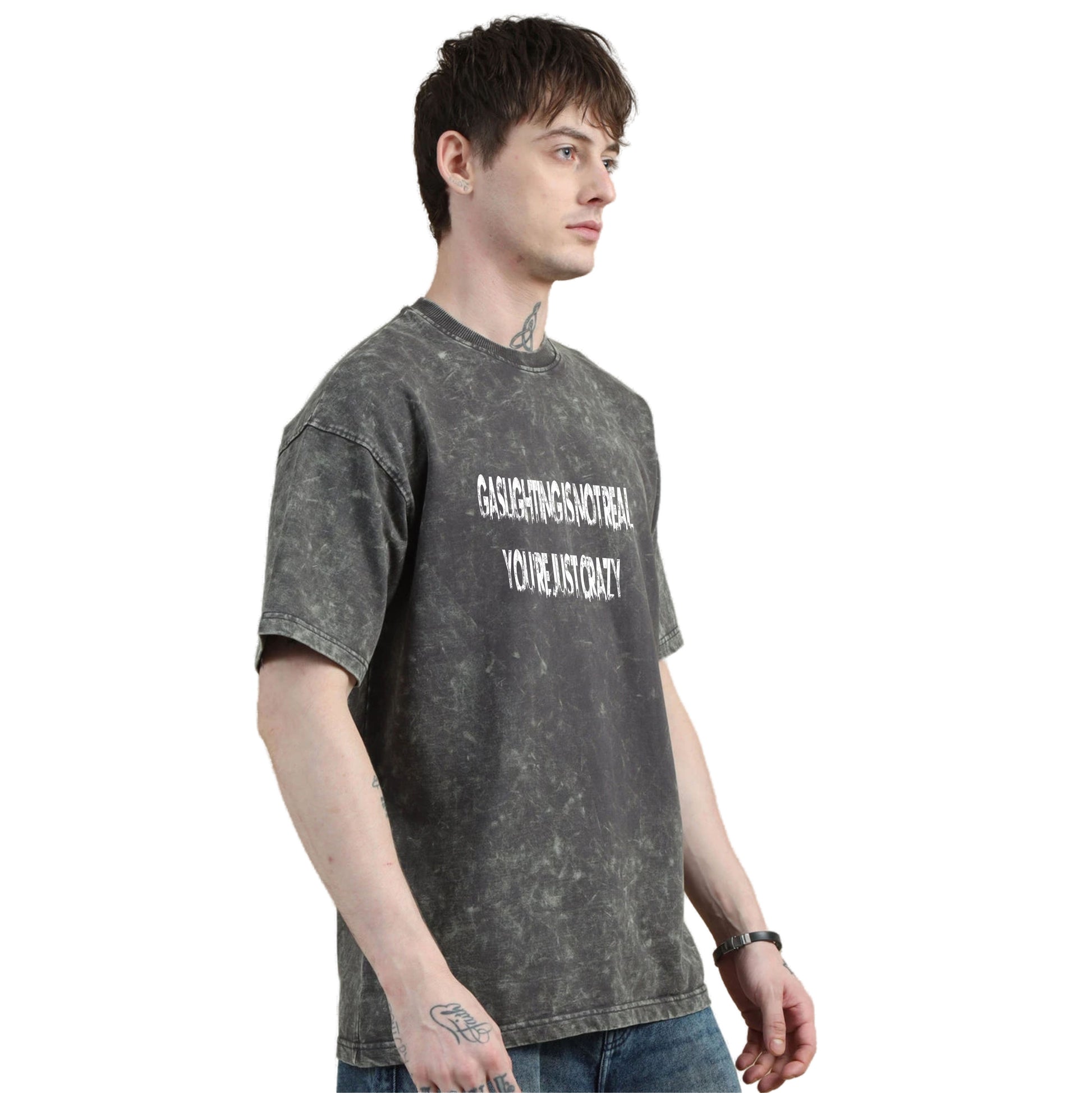 Person wearing a gray t-shirt with text on a white background