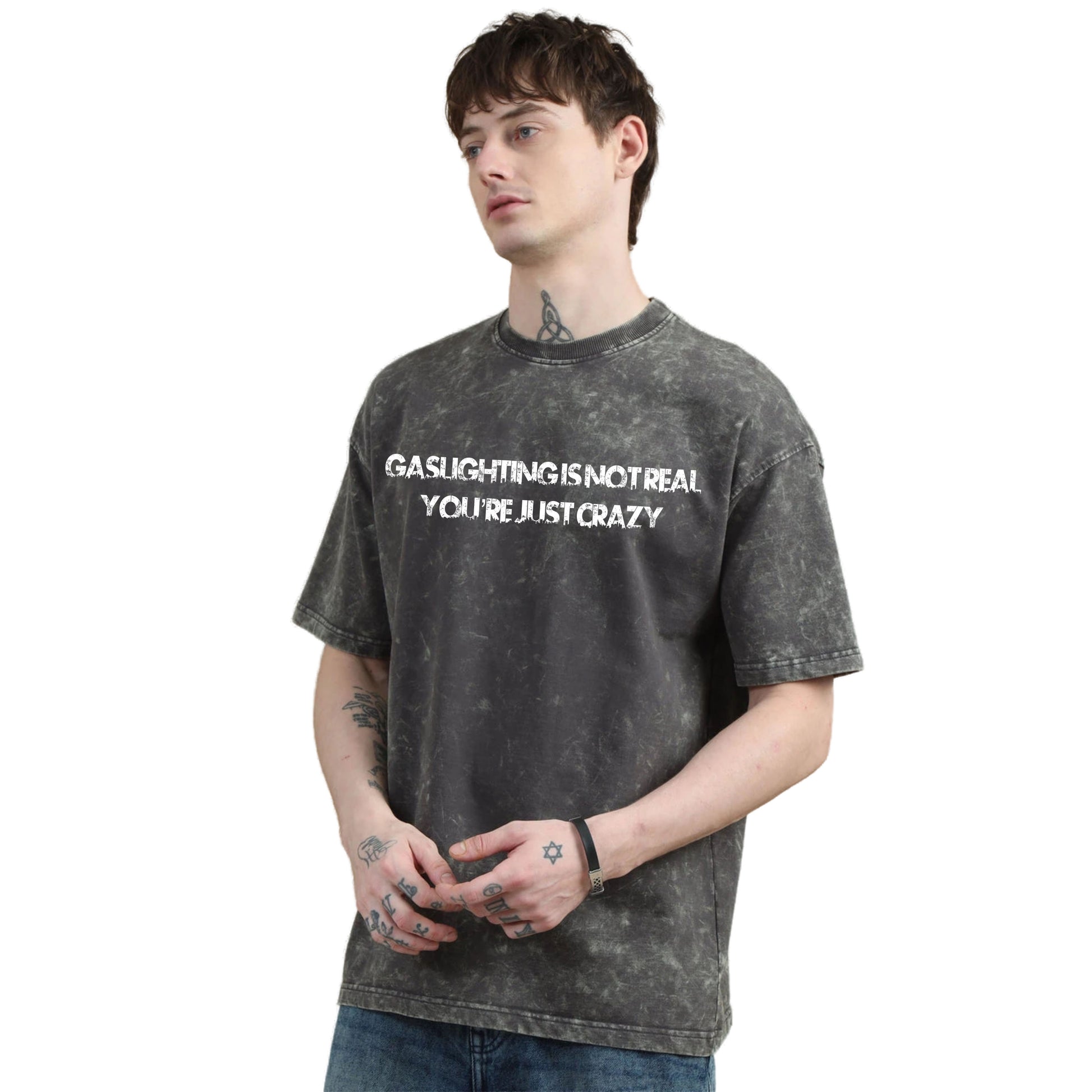 Person wearing a black t-shirt with text on a white background