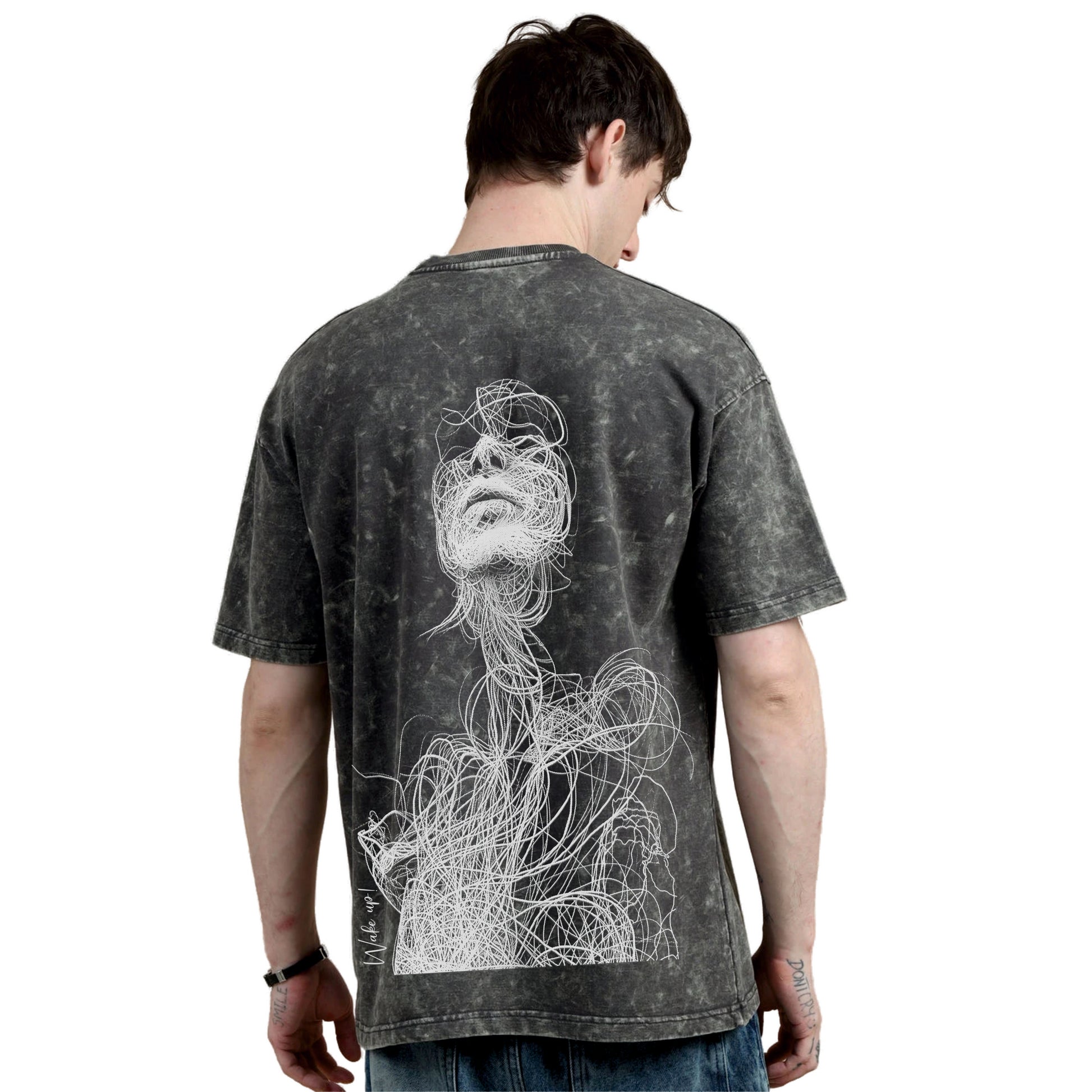 Person wearing a t-shirt with a white graphic design on the back against a white background